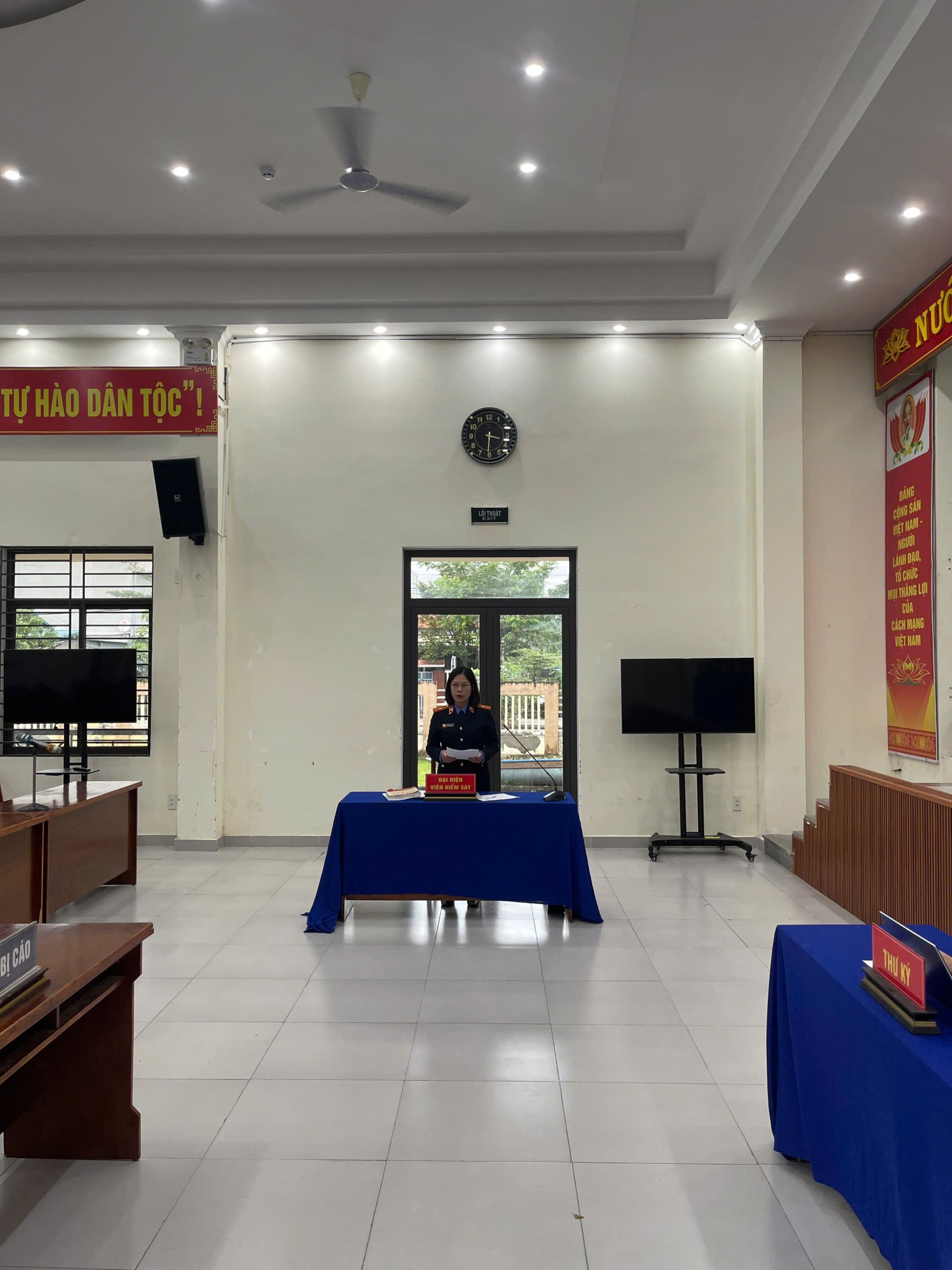 '''A person standing behind a table
AI-generated content may be incorrect.'''