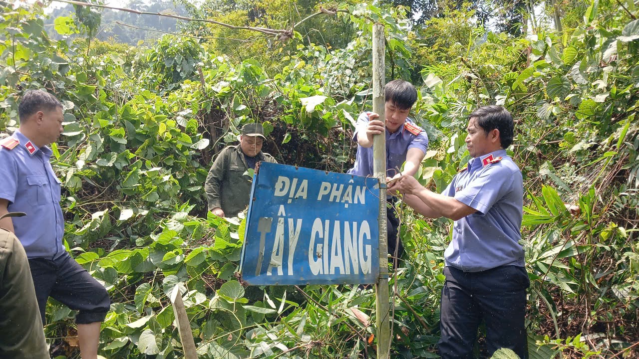 ''''A group of men standing next to a sign

AI-generated content may be incorrect.''''