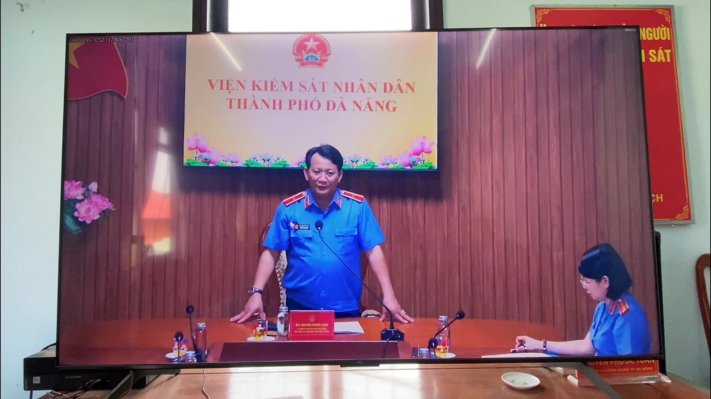 '''''A person in a blue uniform standing at a desk

AI-generated content may be incorrect.'''''